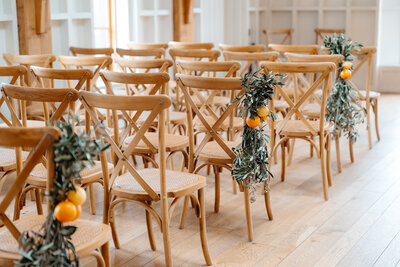 Elegant wedding ceremony floral displays and aisle decorations at Hyde House